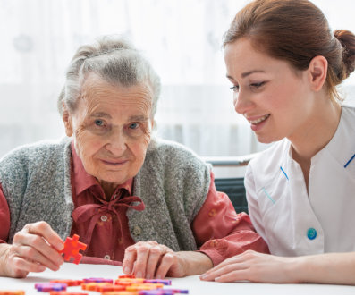 a caregiver talking with a woman