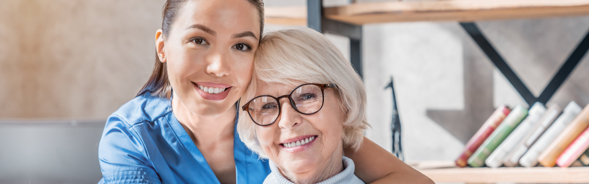 caregiver and elderly smiling